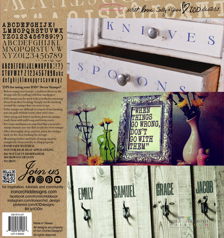 Wooden drawers labeled Knives and Spoons with flowers, IOD Letterpress Stamp by I.O.D., quotes, and name tags.