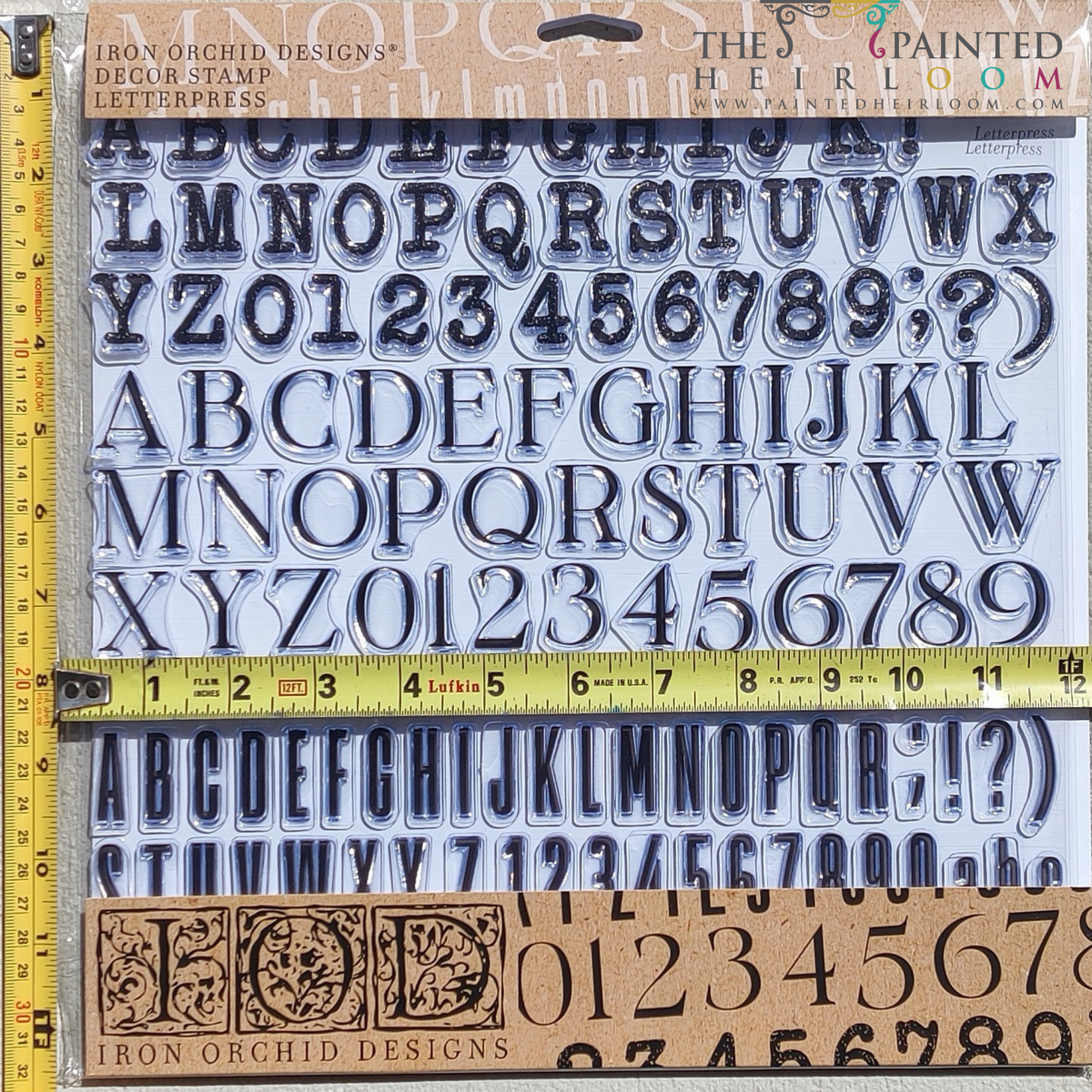 Four Iron Orchid Designs I.O.D. Letterpress Stamp sets arranged on a grid cutting mat with yellow rulers.