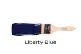 Paintbrush with Liberty Blue Fusion Mineral Paint by Fusion Mineral Paint on a plain background.