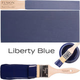 Wooden paintbrush with painted surface in Liberty Blue by Fusion Mineral Paint.
