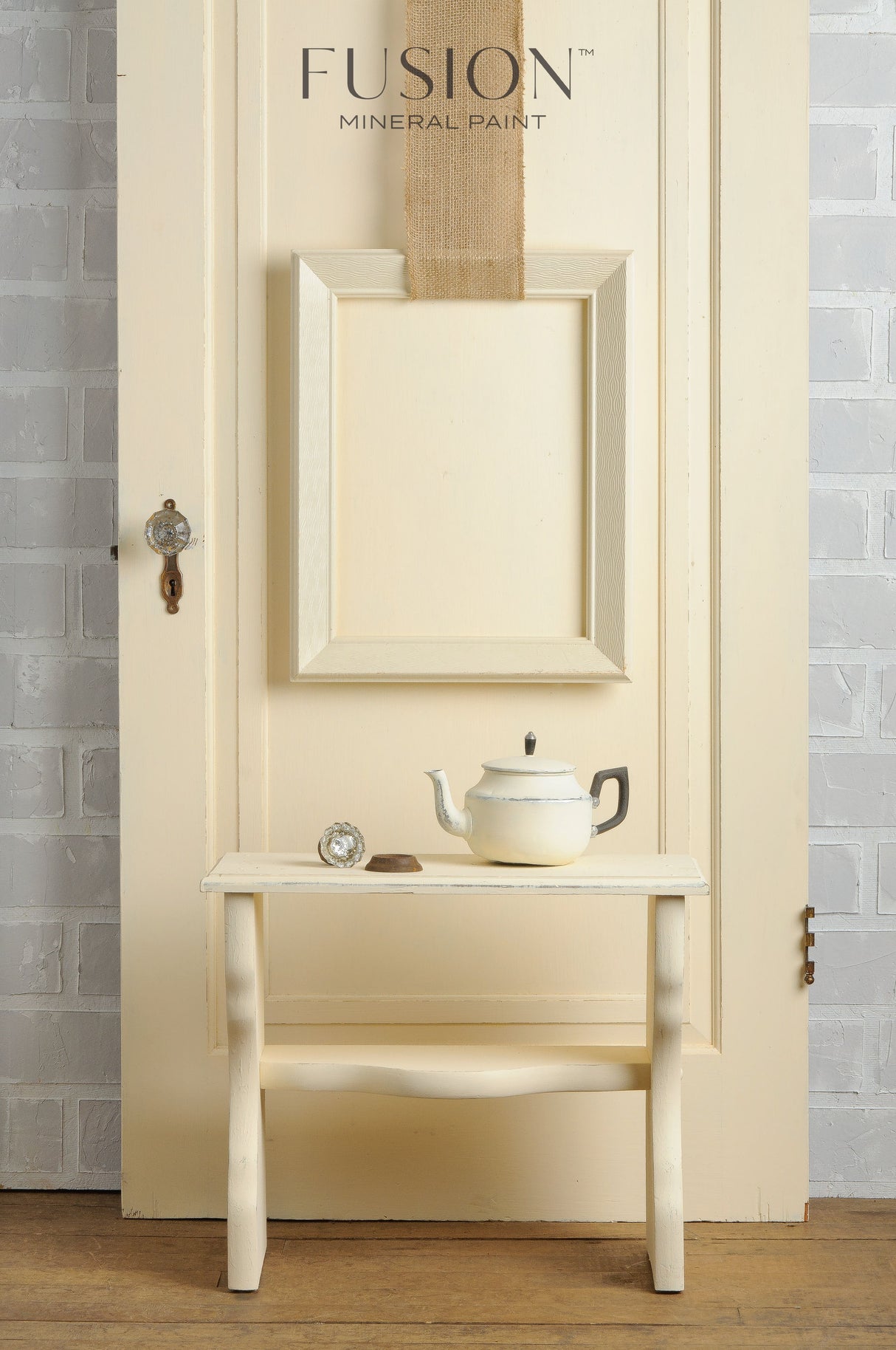 Limestone Fusion Mineral Paint teapot and teacup set by Fusion Mineral Paint on a bench near a cream door.