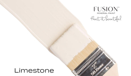 Brush with off-white, matte Limestone Fusion Mineral Paint; Fusion Mineral Paint logo in top right corner.