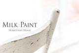 White wooden chair painted with Limestone Milk Paint by Homestead House.