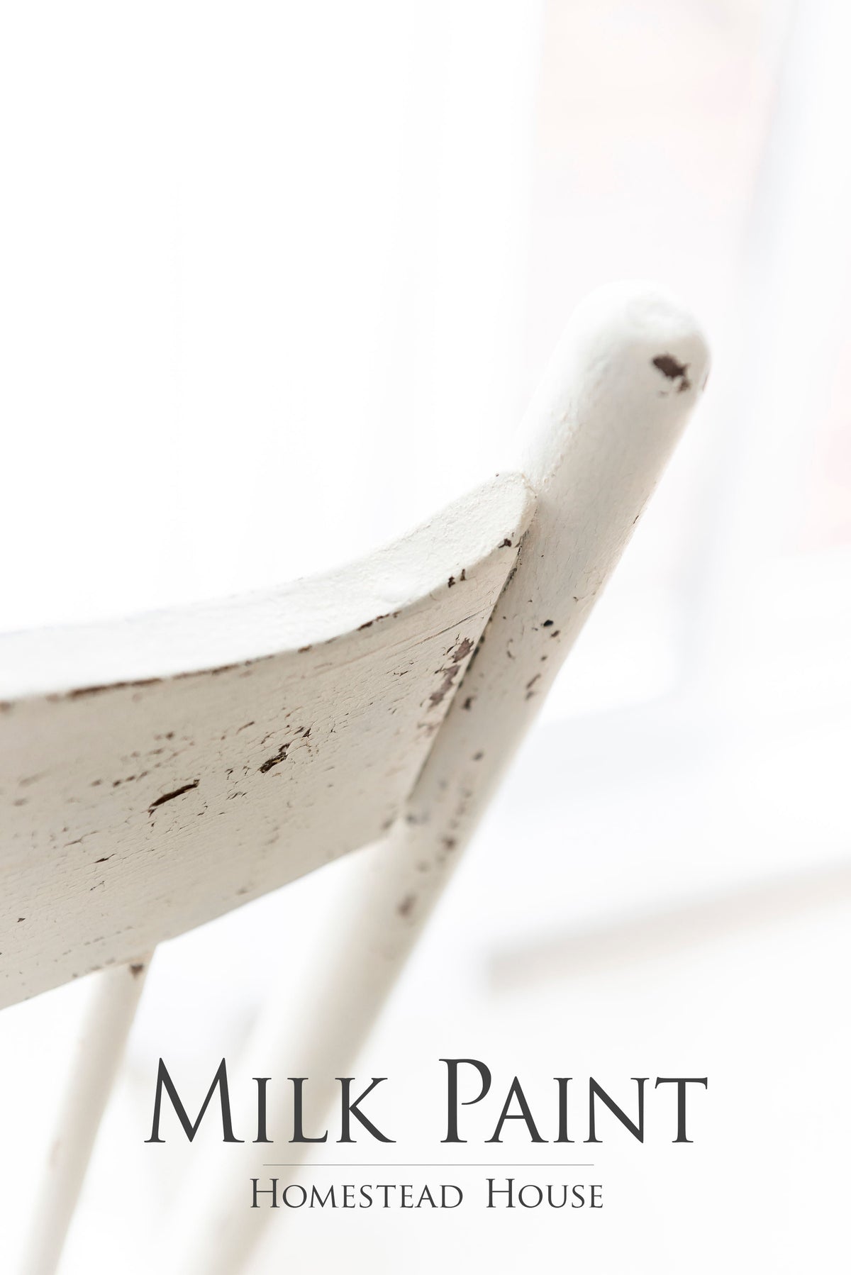 Distressed white chair finished with Homestead House Limestone Milk Paint; partial text visible below.