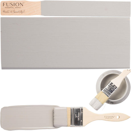 Fusion Mineral Paint Little Lamb can with brush coated in gray and matte wood sample.
