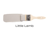 Paintbrush with Fusion Mineral Paint Little Lamb, matte gray color, shown on a white background.