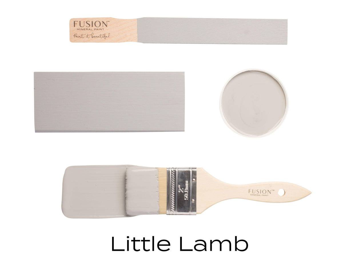 Four paint samples and a brush with Little Lamb Fusion Mineral Paint, a matte gray by Fusion Mineral Paint.