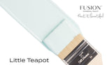 Brush with teal “Little Teapot Fusion Mineral Paint (Seasonal)” by Fusion Mineral Paint against a white background.