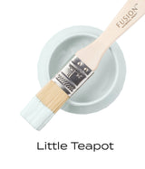 Brush with teal paint on open Little Teapot Fusion Mineral Paint can by Fusion Mineral Paint.