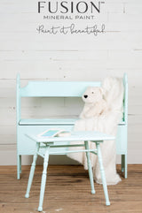 Mint bench and table painted with Fusion Mineral Paint Little Teapot, shown with a polar bear plush and cream blanket.
