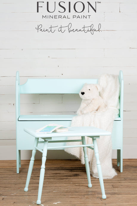 Mint bench and table painted with Fusion Mineral Paint Little Teapot, shown with a polar bear plush and cream blanket.