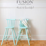 Two light blue chairs, one with plaid, painted in Fusion Mineral Paint’s Little Teapot (seasonal).