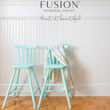 Two light blue chairs, one with plaid, painted in Fusion Mineral Paint’s Little Teapot (seasonal).