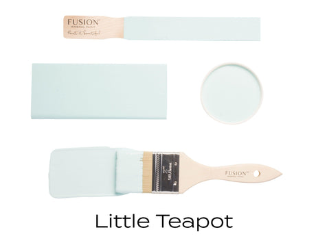 Brush, lid, and swatch of Little Teapot Fusion Mineral Paint in light blue.
