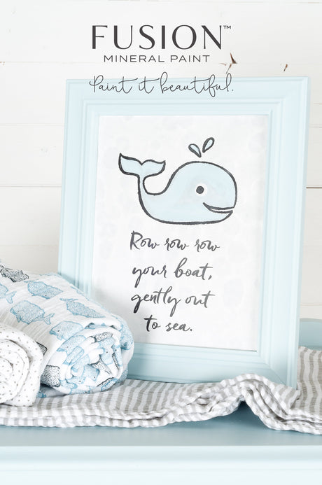 Framed print featuring a smiling blue whale in Little Whale Fusion Mineral Paint with “Row row row your boat” text.