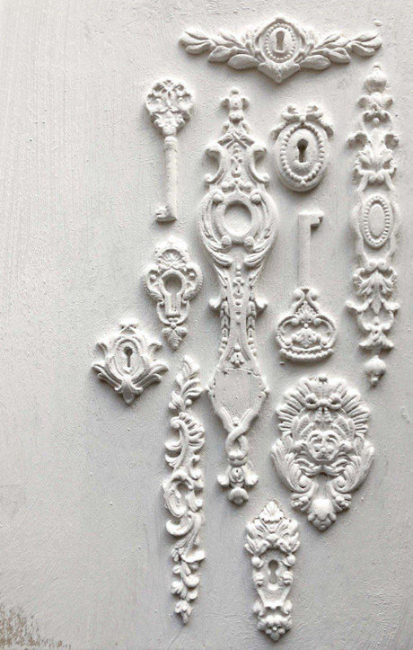 White keyholes created with I.O.D. Lock and Key Mould displayed against a white background.