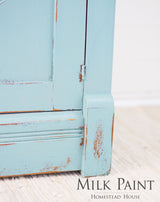 Distressed light blue cabinet, “Loyalist Milk Paint by Homestead House” text at bottom right.