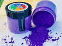 Two DIY Paint Co. Making Powder jars, one standing upright and one tipped over with powder spilled.