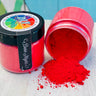 Open jar of DIY Debi’s Design Diary Making Powder spilling beside closed, colorful DIY Paint Co. jar.