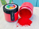 Open jar of DIY Debi’s Design Diary Making Powder spilling beside closed, colorful DIY Paint Co. jar.