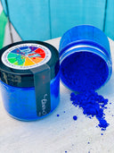 Two jars of DIY Paint Co. Making Powder; one is open with bright blue powder spilling out.