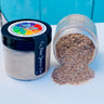 New Years Eve DIY Paint Co. Making Powder by Debi’s Design Diary spilled from jar with upright lid on white surface.