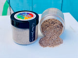 New Years Eve DIY Paint Co. Making Powder by Debi’s Design Diary spilled from jar with upright lid on white surface.