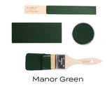Four Manor Green Fusion Mineral Paint samples with brush on white background; rich, deep green shade.