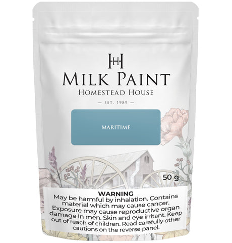 50g Homestead House Maritime Blue Milk Paint bag with safety warnings and floral design on packaging.