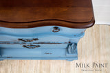 Vintage blue dresser in Homestead House Maritime Blue Milk Paint with ornate metal handles, top view.