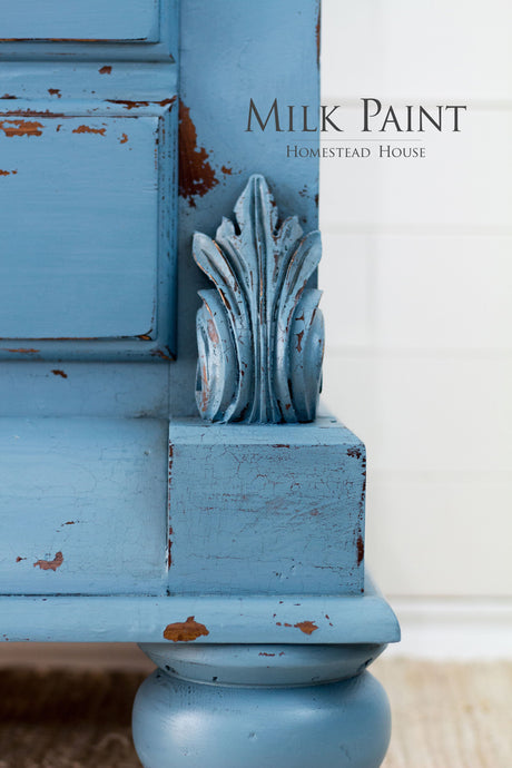 Maritime Blue Milk Paint by Homestead House on ornate furniture corner, text reads “Homestead House”.