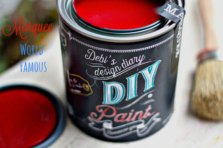 Open can of Marquee DIY Paint by DIY Paint Co. with brush and lid placed nearby.
