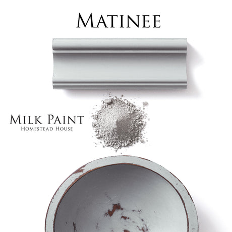 Gray powder pile, painted sample, and Matinee Milk Paint by Homestead House tin demonstrating paint coverage.