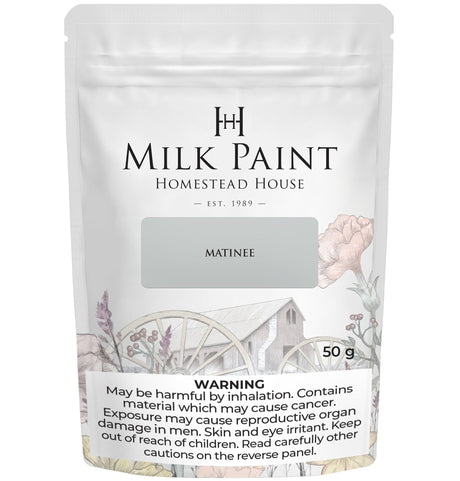 50g pouch of Matinee Milk Paint by Homestead House with warning text and “great paint coverage” at the bottom.