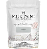 Homestead House Matinee Milk Paint 330g bag with rustic wagon graphic and visible safety warning.