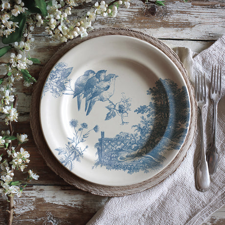 Meadowlark by I.O.D. plate with blue bird and floral design, brand name stamped on front.