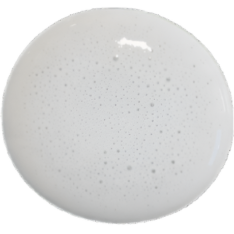 Round white speckled plate finished with Sweet Pickins Milk Paint by Old Fashioned Milk Paint.