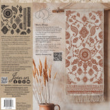 Wall hanging with brown geometric floral pattern made with I.O.D. Mercy House Chitenge Stamp.