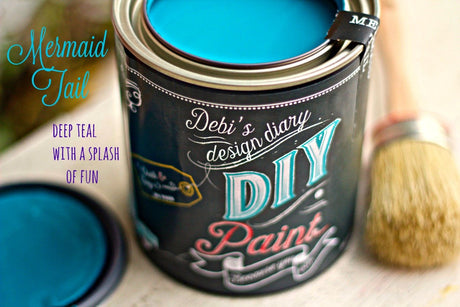 Open can of Mermaid Tale DIY Paint by DIY Paint Co. next to a brush, with text “deep teal with a splash of fun.”.
