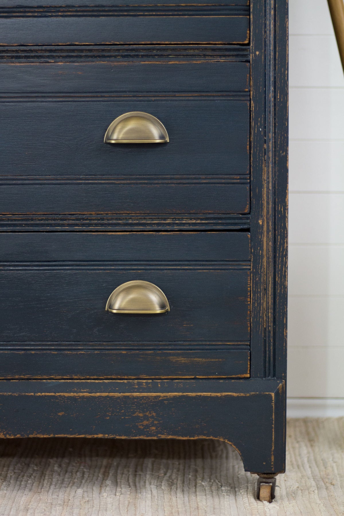 Homestead House Midnight Blue dresser with brass handles and visible wood grain details.