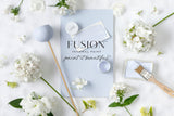 Mist Fusion Mineral Paint with matte swatch, paintbrush, and white flowers on a textured white surface.