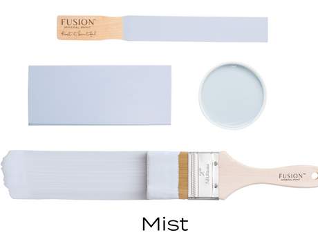 Four paint samples and a brush with Mist Fusion Mineral Paint arranged on a white background.