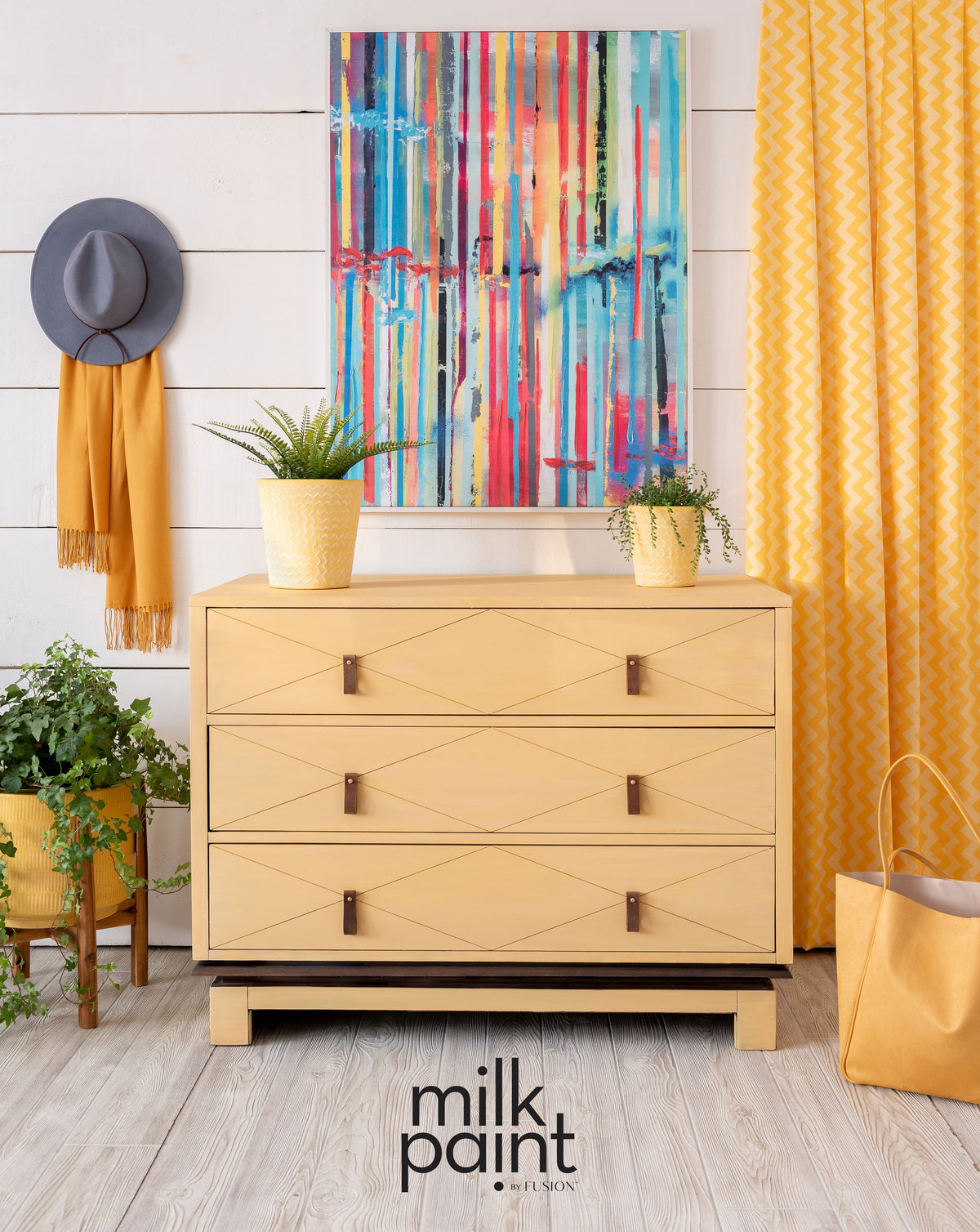 Dresser painted in Mod Mustard Milk Paint by Fusion, styled with decor and plants.