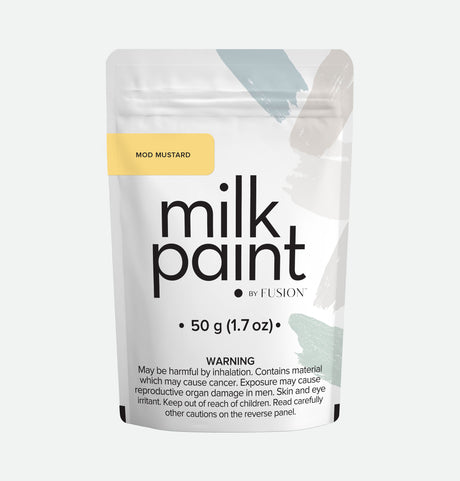 Fusion Mineral Paint Mod Mustard Milk Paint pouch, 50g, includes bonding agent and cancer warning on front label.