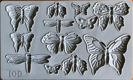 I.O.D. Monarch Mould: gray silicone tray with butterfly, moth, and dragonfly shapes by Iron Orchid Designs.