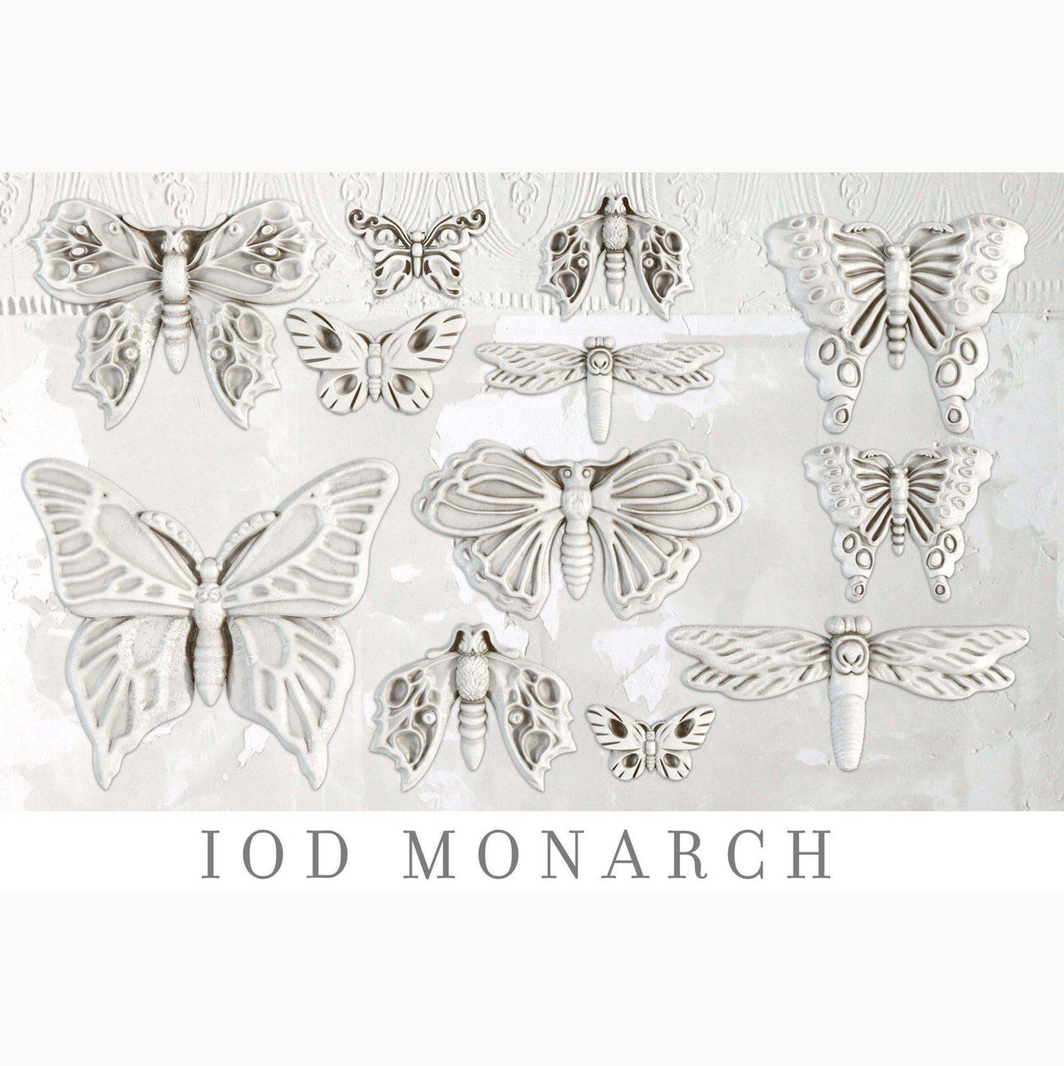 White butterfly and moth sculptures made with Monarch Mould by IOD (Iron Orchid Designs) on a light background.