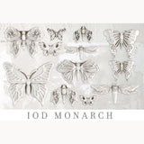 White butterfly and moth sculptures made with Monarch Mould by IOD (Iron Orchid Designs) on a light background.