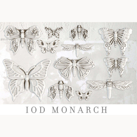 White butterfly and moth sculptures made with Monarch Mould by IOD (Iron Orchid Designs) on a light background.