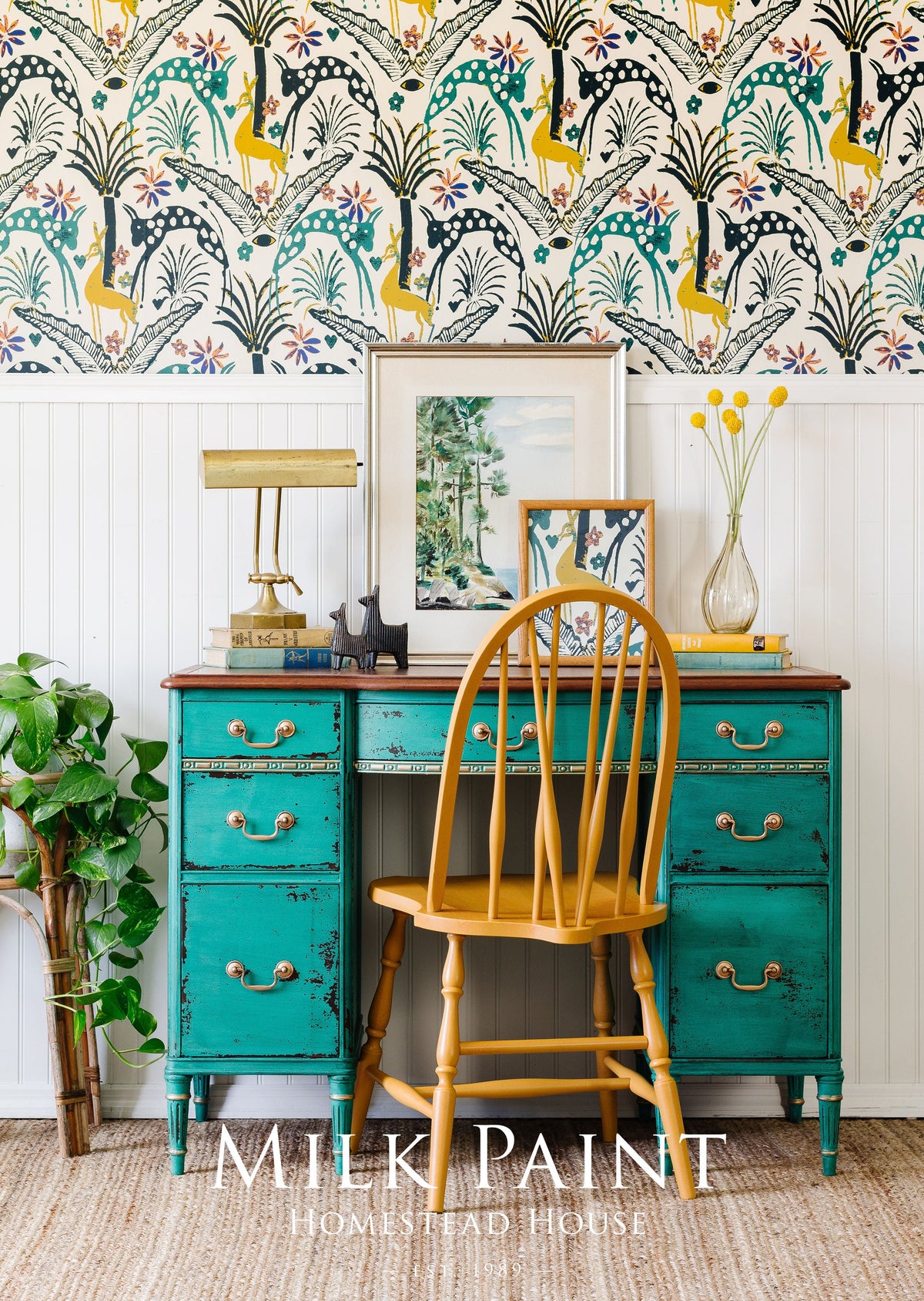 Teal desk painted with Montclair Milk Paint by Homestead House, paired with wood chair and lamp.