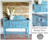 Blue sideboard with floral knobs, painted Moody Blue by Old Fashioned Milk Paint.